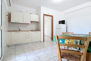 Fridge, stovetop, cookware/dishes/utensils