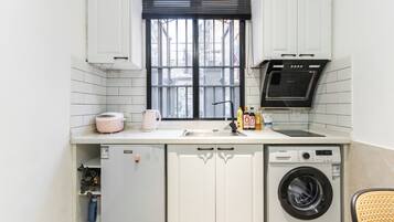 Suite, 1 Double Bed | Private kitchen | Fridge, paper towels, dining tables