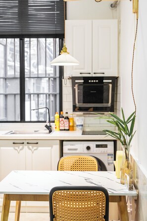 Suite, 1 Double Bed | Private kitchen | Fridge, paper towels, dining tables