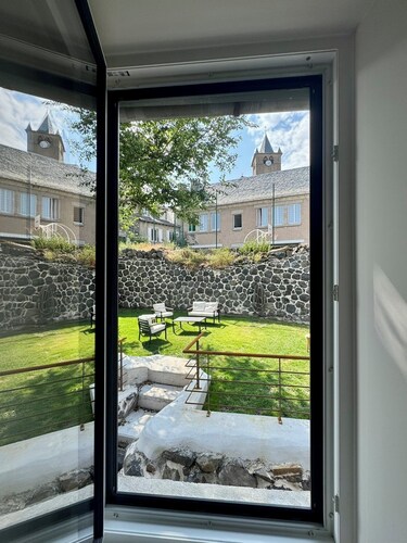 House in the shadow of the bell tower