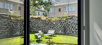 House in the shadow of the bell tower