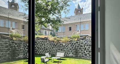 House in the shadow of the bell tower