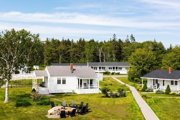 Stroll quiet paths between classic cottages and sunny lawns.