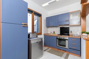 Maison mitoyenne Standard, 2 chambres (La Guzzetta Stintinese) | Cuisine privée | Réfrigérateur, micro-ondes, four, plaque de cuisson