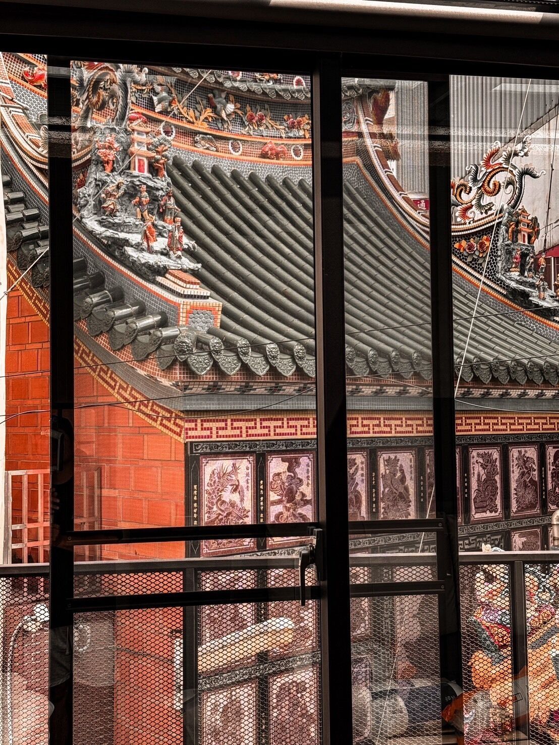A traditional Chinese architectural style with intricate designs and a tiled roof.