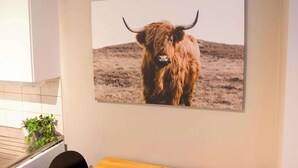 A kitchen with a large framed picture of a yak on the wall. - Practical 3-Beds Apartment in Tromsø (Tromsø)