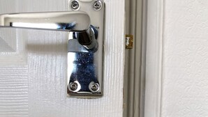 A door with a silver handle and a keyhole, secured with a metal plate and screws. - Modern room for short stay in Salford
ONLY SPARE ROOM TO LET IN Shared House (Salford)