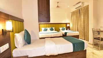 Family Room, City View | Premium bedding, in-room safe, desk, laptop workspace