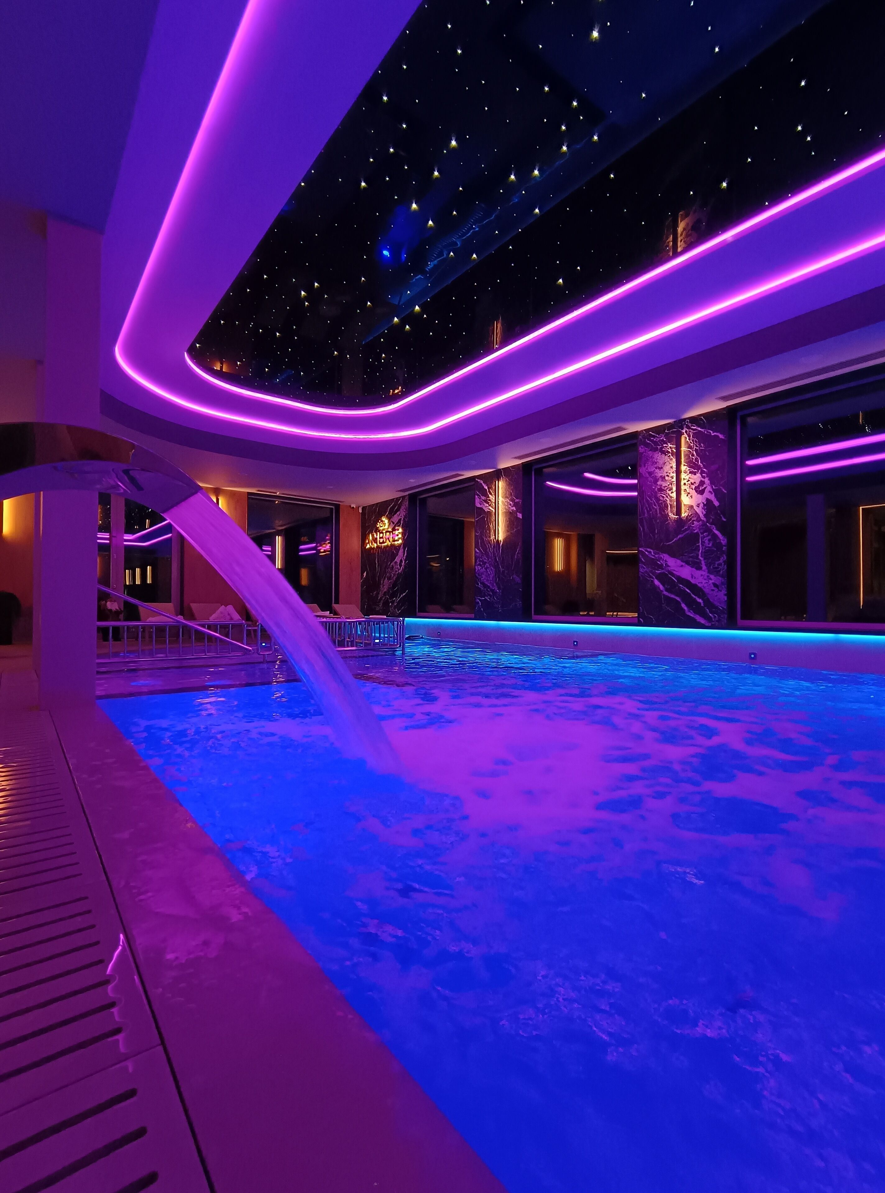 Indoor pool, open noon to 8:00 PM, pool loungers, lifeguards on site