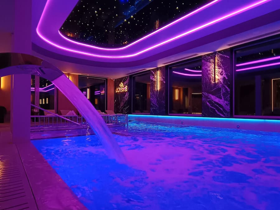 Indoor pool, open noon to 8:00 PM, pool loungers, lifeguards on site