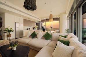 Deluxe Penthouse, Balcony, Sea View | Living area | 130-cm Smart TV with cable channels, Netflix, streaming services