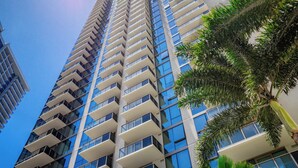 A high-rise building with multiple balconies and large windows. - Modern 2BR at Sky Ala Moana – City & Mtn Views w/ AC/Pool/Gym/1 Parking (Honolulu)