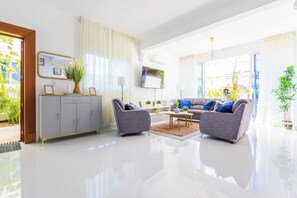 Comfort Villa, Pool View | Living area | 50-inch Smart TV with digital channels, Netflix, streaming services