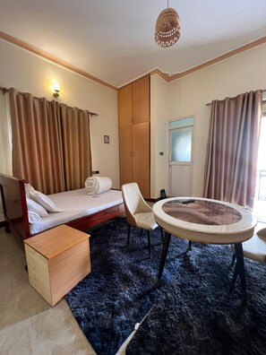 Economy Double Room, Garden View | Bathroom | Shower, free toiletries, slippers, soap
