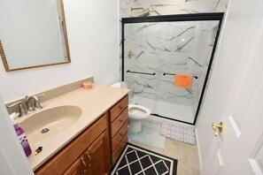 Shower, hair dryer, towels