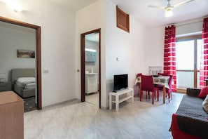 Apartment, 1 Queen Bed with Sofa bed | Living area | 30-inch TV with satellite channels