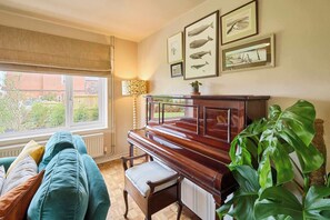 TV, fireplace, books, offices - Host & Stay | The Beach House (Overstrand)