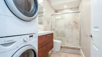 Shower, towels, soap, toilet paper