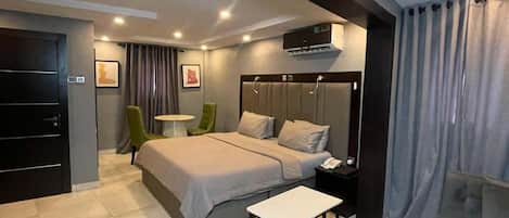 Deluxe Room, Balcony, City View | Desk, laptop workspace, blackout curtains, soundproofing