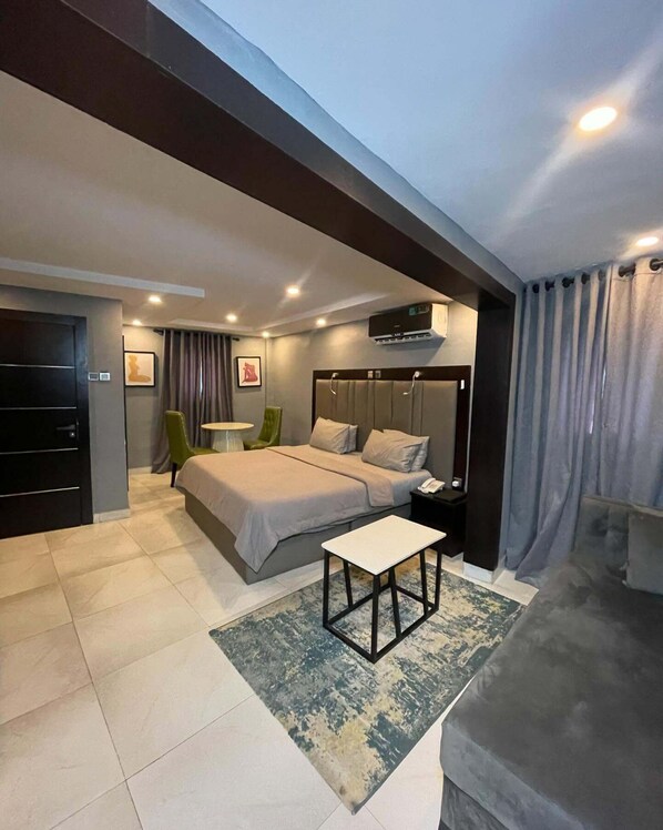 Deluxe Room, Balcony, City View | Desk, laptop workspace, blackout drapes, soundproofing