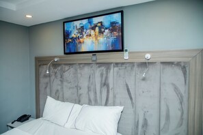 Deluxe Room, Balcony, City View | Desk, laptop workspace, blackout drapes, soundproofing