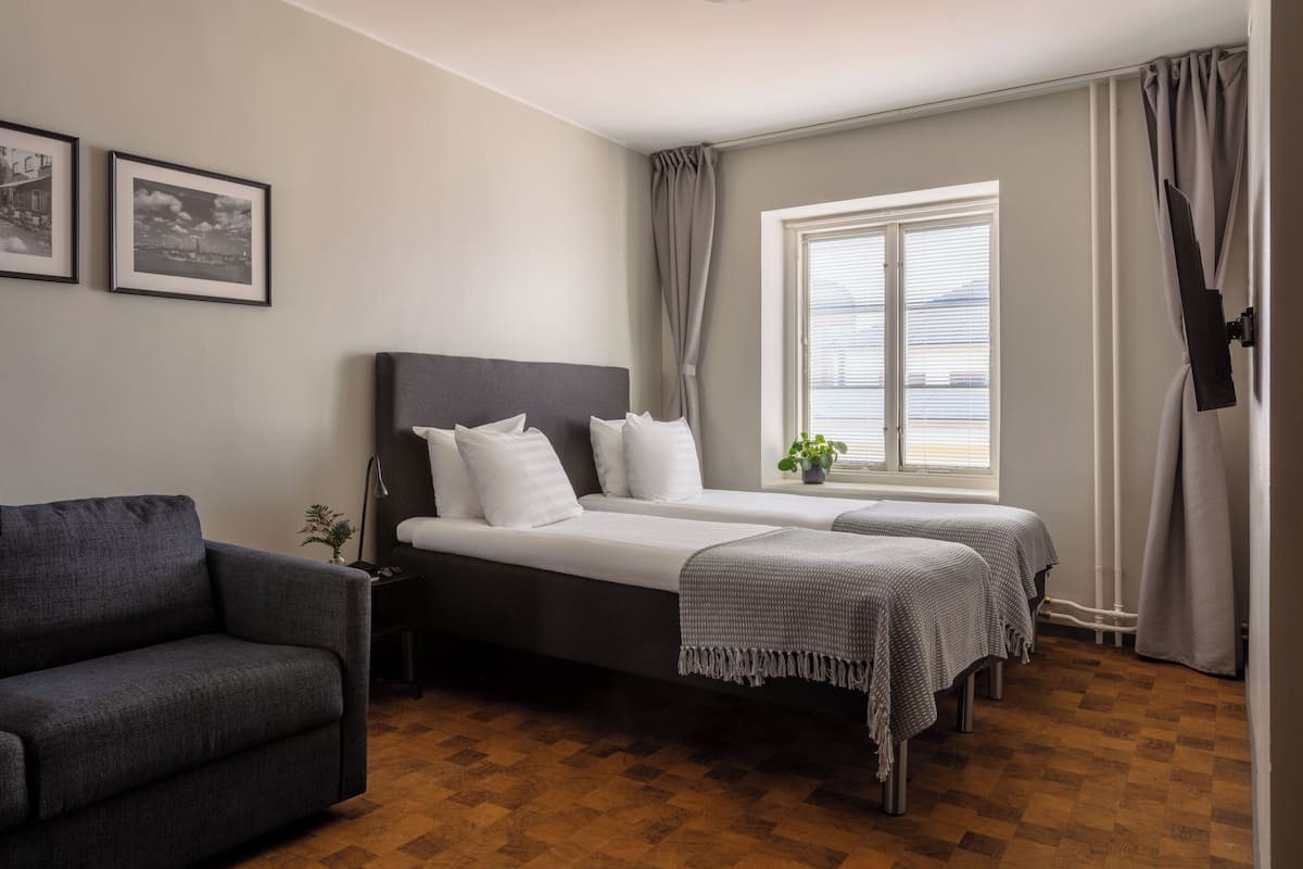 Apartamento superior | Wi-Fi de cortesia, roupa de cama