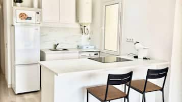 Fridge, oven, cookware/dishes/utensils