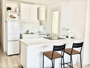 Fridge, oven, cookware/dishes/utensils