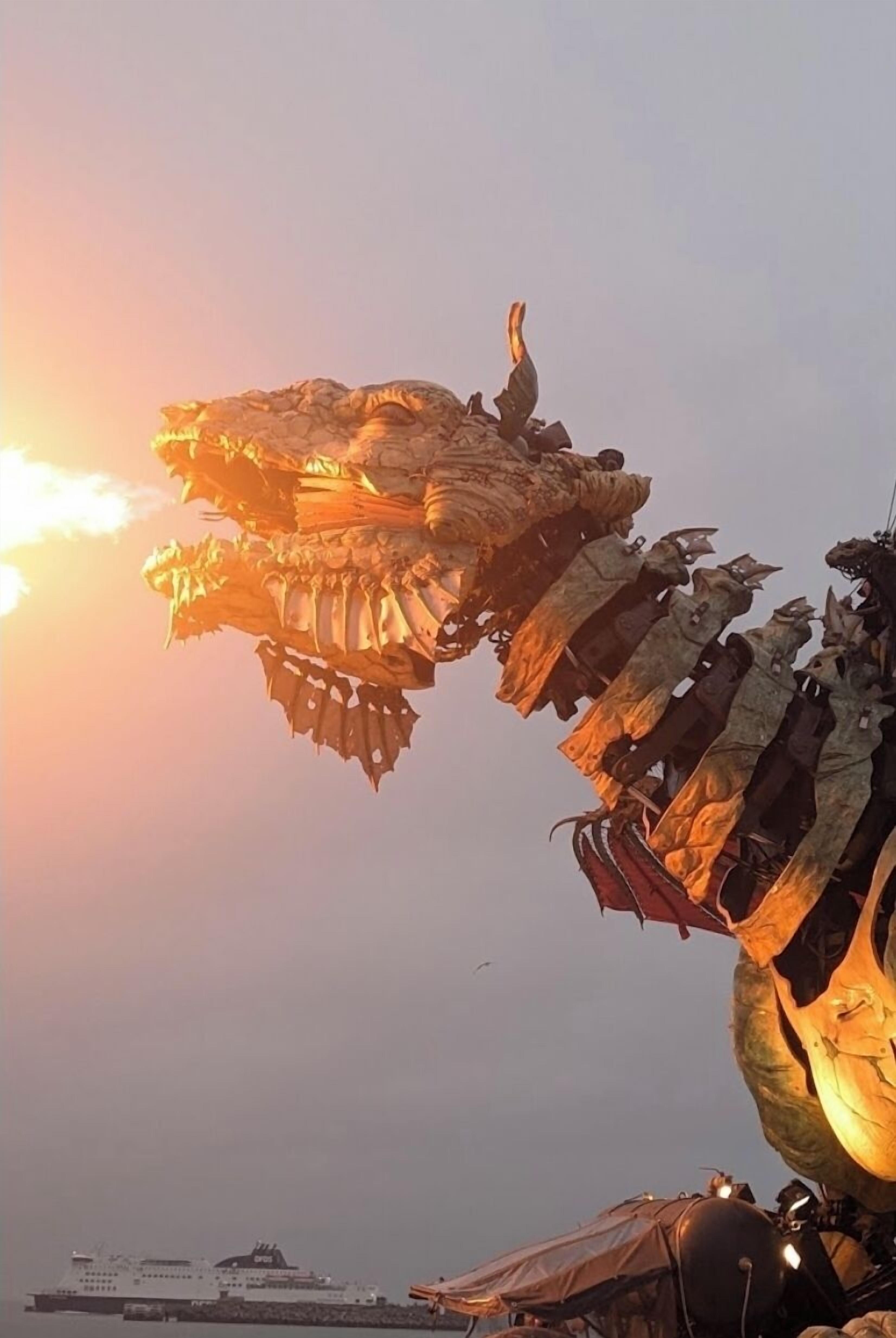 A large mechanical dragon-like structure with a fiery effect, possibly part of an event or attraction.