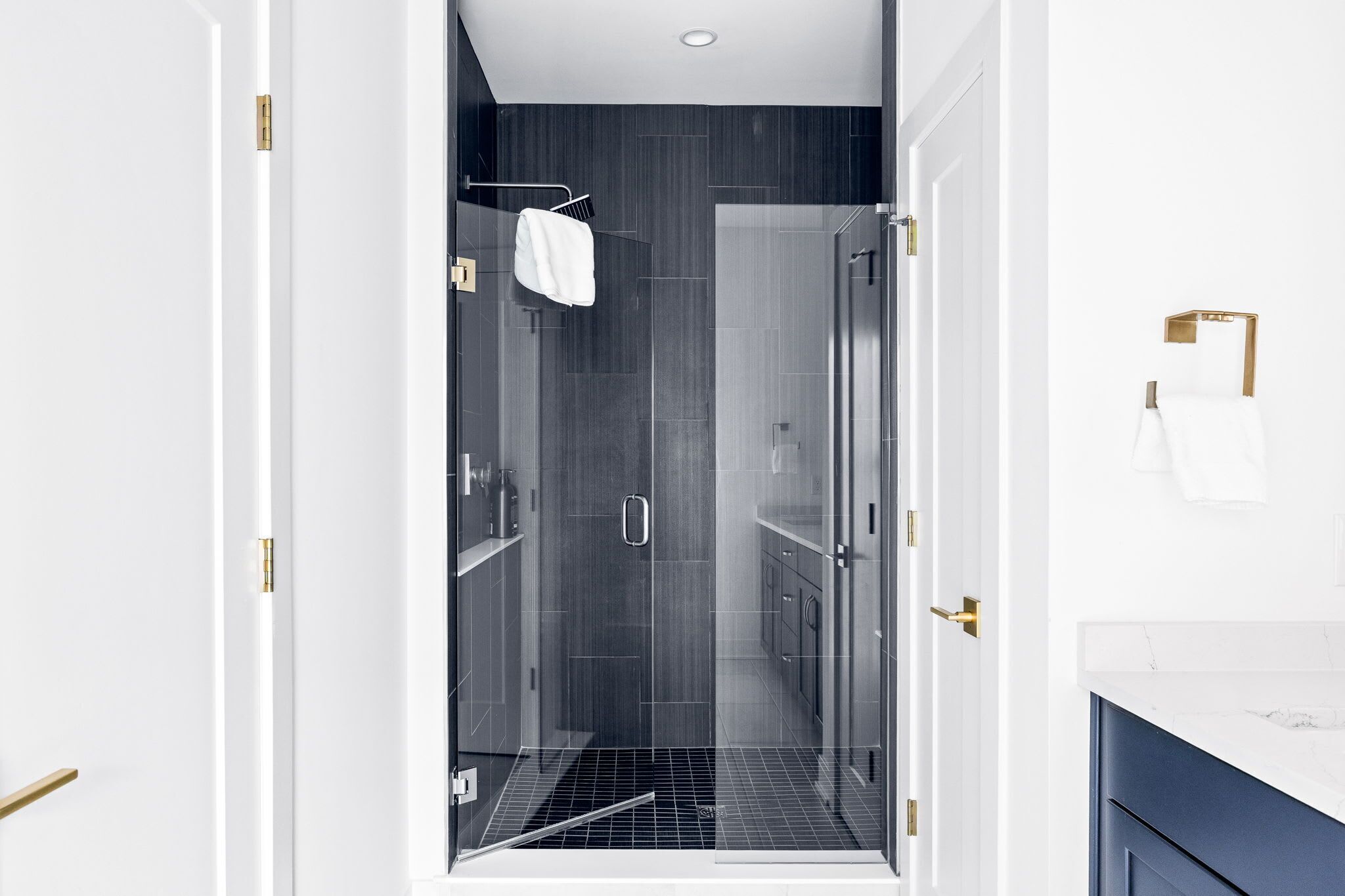 Shower, hair dryer, towels, shampoo