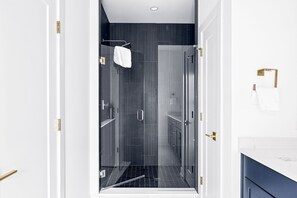 Shower, hair dryer, towels, shampoo