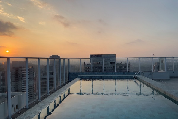 Outdoor pool, open 7:00 AM to 10:00 PM, pool umbrellas