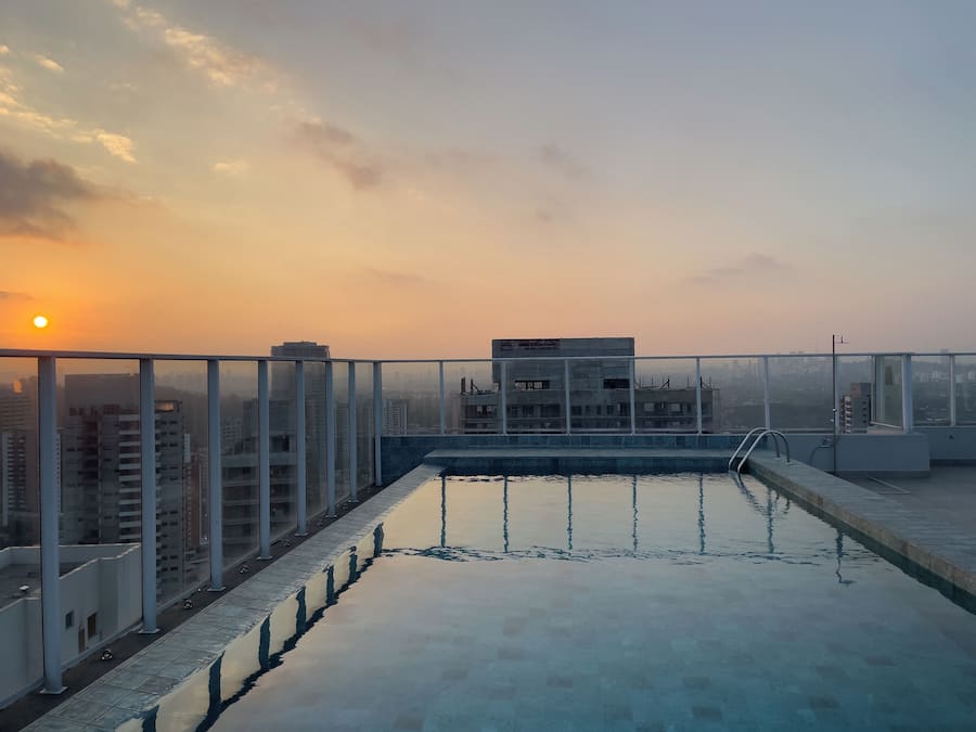 Outdoor pool, open 7:00 AM to 10:00 PM, pool umbrellas