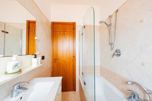 Hair dryer, bidet, towels, toilet paper