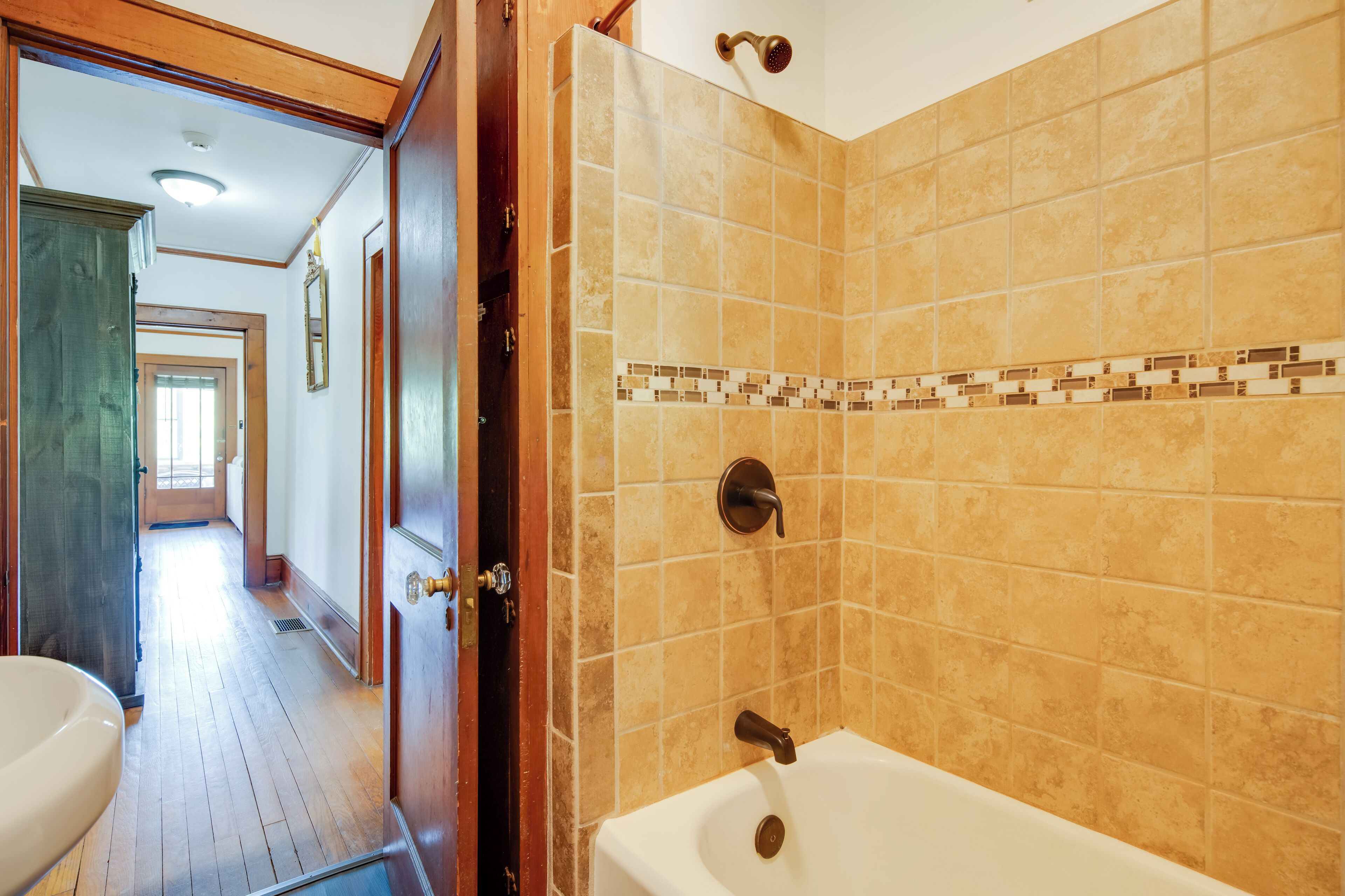 A bathroom with a bathtub, a shower, and a toilet.