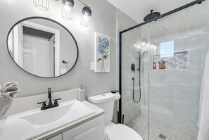 Shower, hair dryer, towels, shampoo
