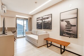 Executive Studio | Living area | Flat-screen TV