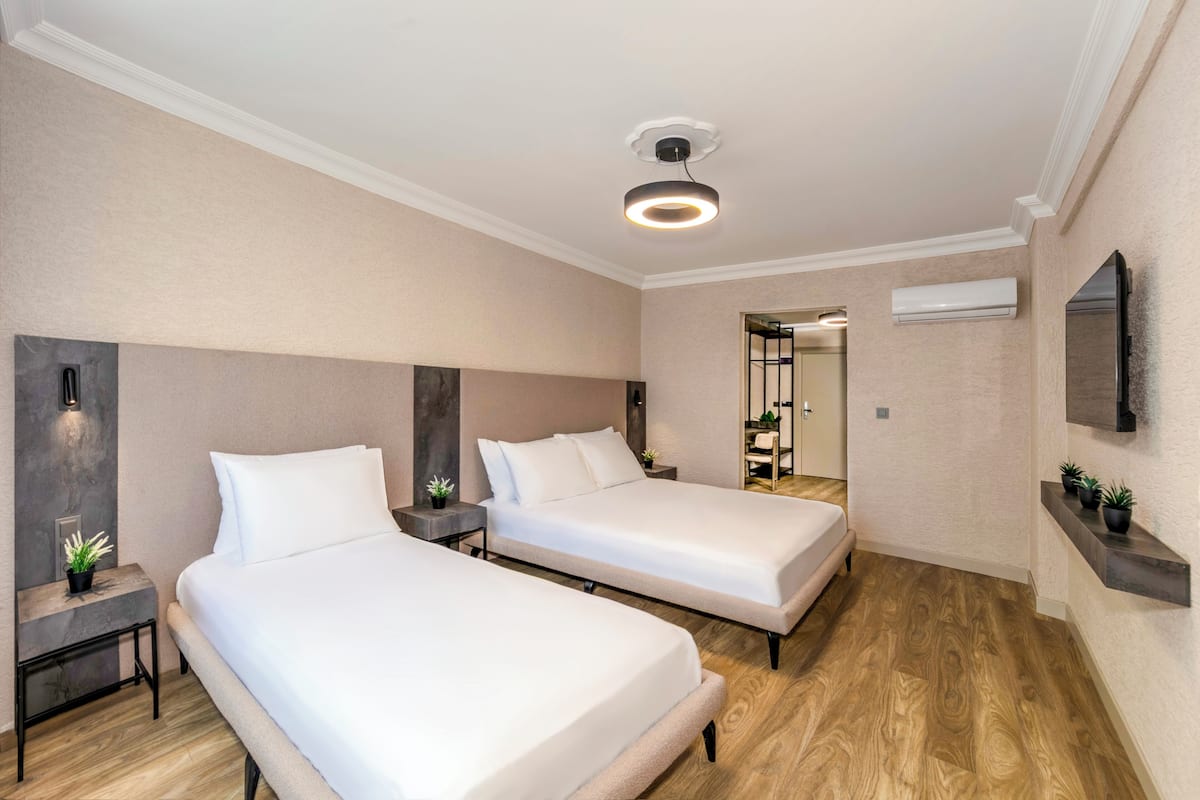 Family Room | Premium bedding, in-room safe, desk, laptop workspace