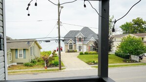 A residential street with houses, a fire hydrant, and power lines. - 2nd Floor Lakeview 2-Bedroom Condo in Geneva U4 (Geneva)