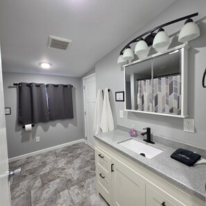 Shower, hair dryer, towels, soap - 4-bedroom, 2 full bath home centrally located in beautiful Benzie County (Beulah)