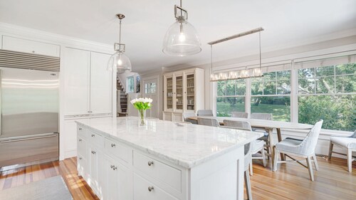 Elegant Coastal Escape with Expansive Yard, Heated Pool, and Outdoor...