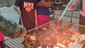 A group of people grilling meat outdoors. - Luxury 2-bedroom apartment with WiFi, AC & Rooftop Jacuzzi pool near Kanyakumari (Suchindram)