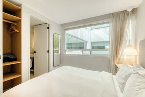 Apartment, 2 Bedrooms | Laptop workspace, blackout drapes, iron/ironing board, free WiFi
