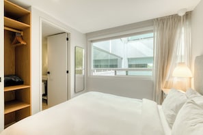 Apartment, 2 Bedrooms | Laptop workspace, blackout drapes, iron/ironing board, free WiFi
