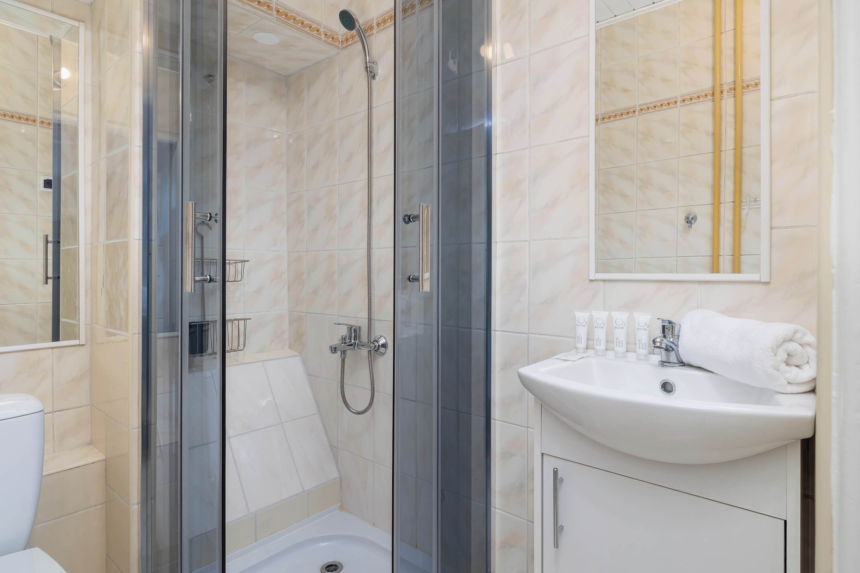 Shower, hair dryer, towels, shampoo