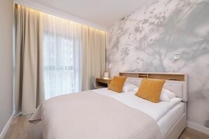 1 bedroom, desk, iron/ironing board, travel crib