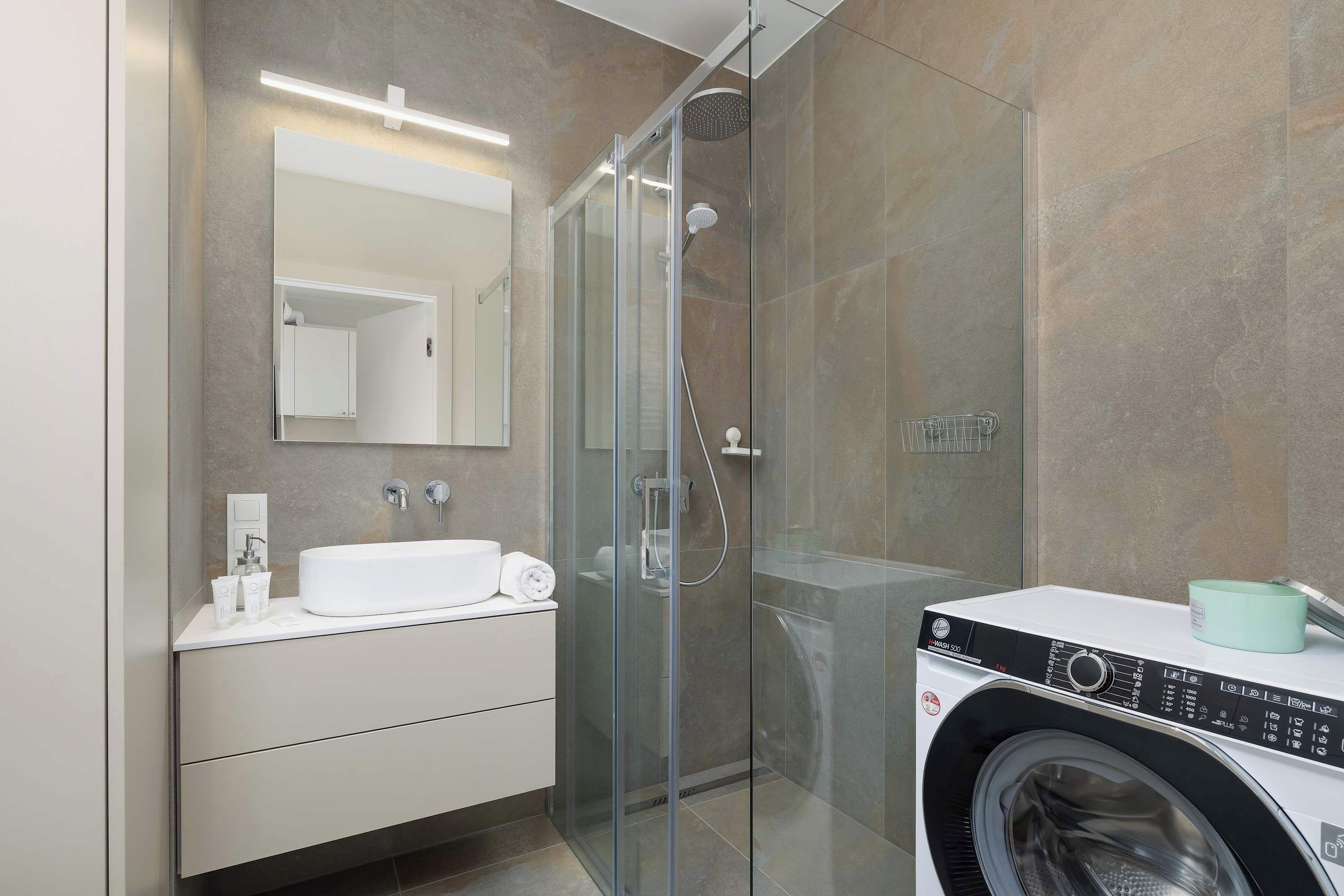 Shower, hair dryer, towels, shampoo
