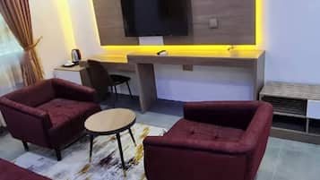 Deluxe Apartment, Balcony, City View | In-room safe, desk, laptop workspace, blackout drapes