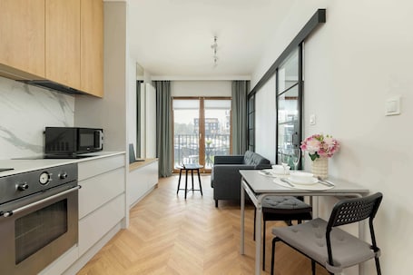 Fridge, microwave, oven, stovetop. Comfortable Studio | Balcony and Private Parking