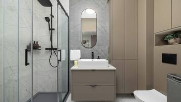 Shower, hair dryer, towels, shampoo